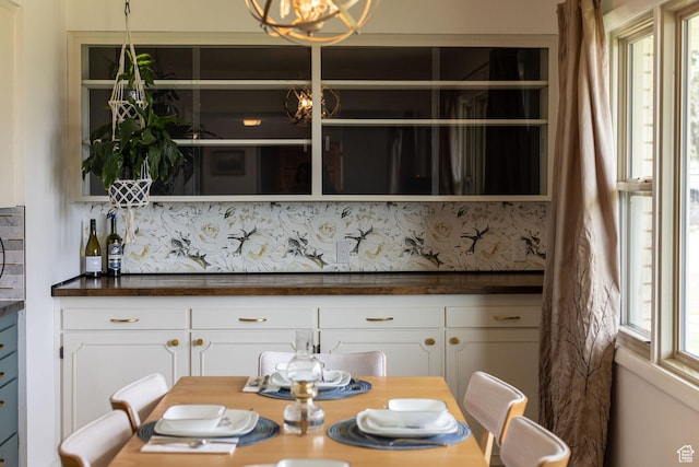 dining space with an inviting chandelier