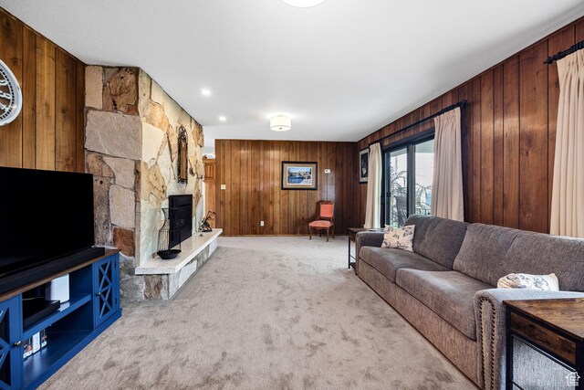 living room featuring wood walls and carpet