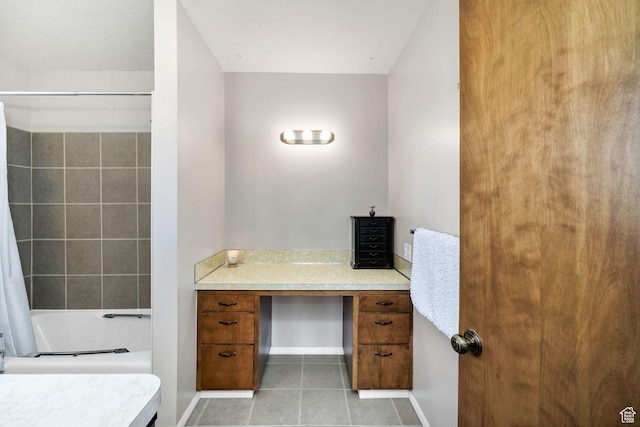 bathroom with shower / bath combo, tile patterned floors, and baseboards