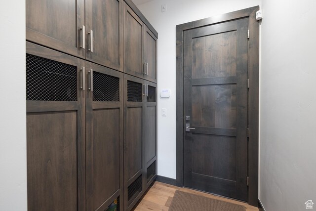 mudroom with light wood-type flooring and baseboards