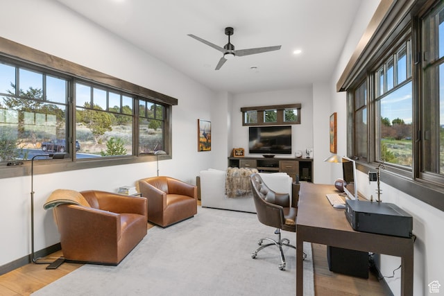 office area with a ceiling fan, plenty of natural light, wood finished floors, and recessed lighting