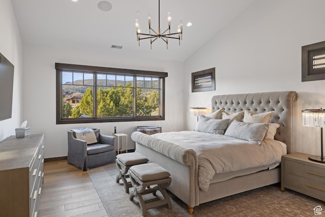 bedroom with visible vents, a chandelier, hardwood / wood-style flooring, recessed lighting, and high vaulted ceiling
