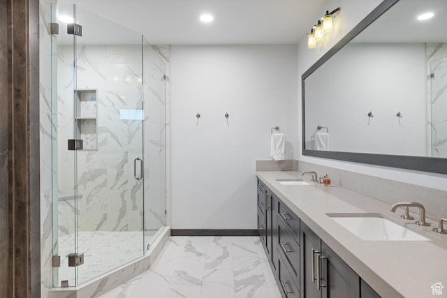 bathroom with a sink, recessed lighting, and marble finish floor