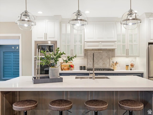 2219 E Fair Winns Ln, Draper, UT 84020 - kitchen with a breakfast bar area, backsplash, and white cabinets