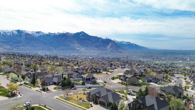 drone / aerial view featuring a mountain view and a residential view