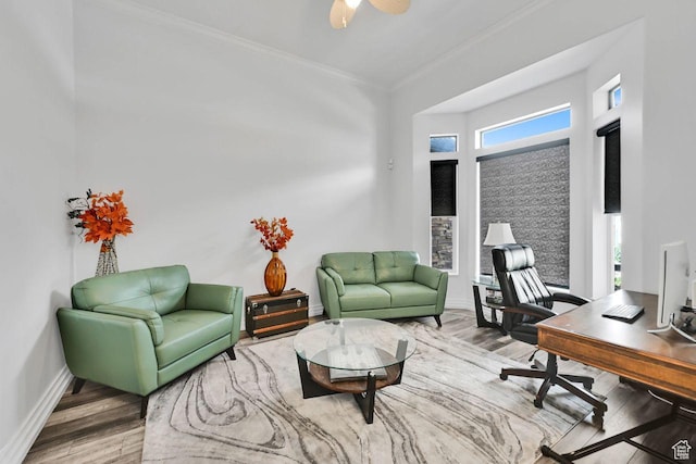 office area with ceiling fan, baseboards, ornamental molding, and wood finished floors
