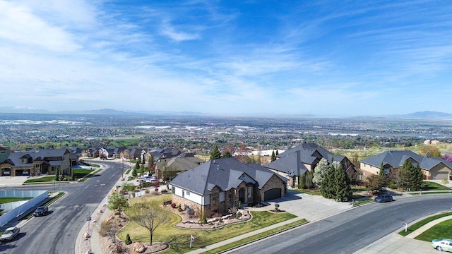 birds eye view of property with a residential view