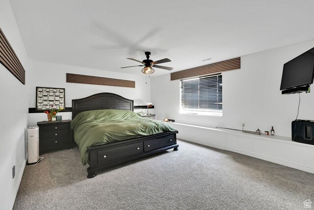 bedroom with baseboards, a ceiling fan, and carpet flooring