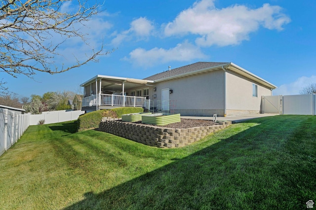 8046 W Harker Canyon Dr, Magna, UT 84044 - rear view of property featuring a gate, a fenced backyard, and a yard