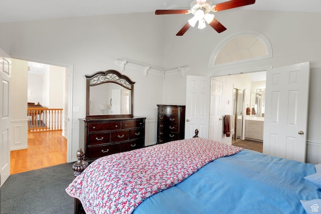 8046 W Harker Canyon Dr, Magna, UT 84044 - carpeted bedroom featuring high vaulted ceiling, wood finished floors, and a ceiling fan