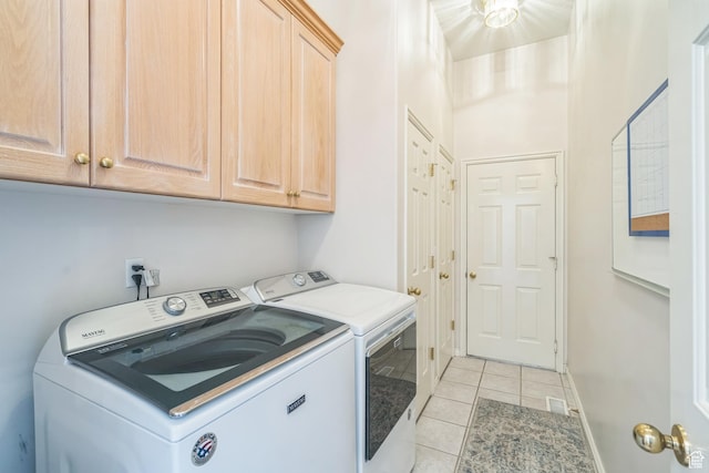 8046 W Harker Canyon Dr, Magna, UT 84044 - laundry area with cabinet space, baseboards, visible vents, washer and clothes dryer, and light tile patterned flooring