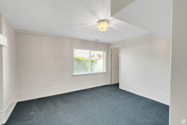 8046 W Harker Canyon Dr, Magna, UT 84044 - spare room with dark carpet, visible vents, and baseboards