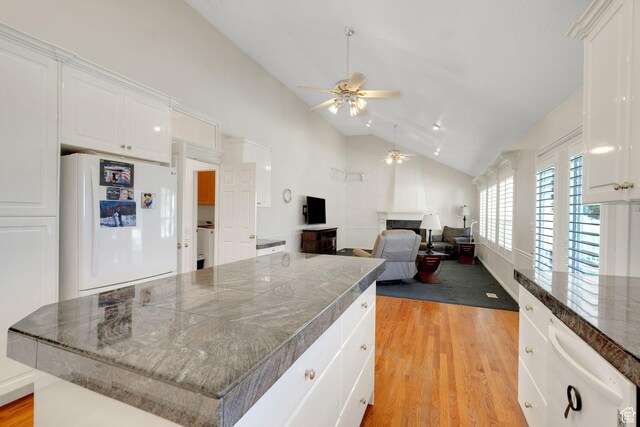 8046 W Harker Canyon Dr, Magna, UT 84044 - kitchen featuring ceiling fan, white cabinets, and freestanding refrigerator