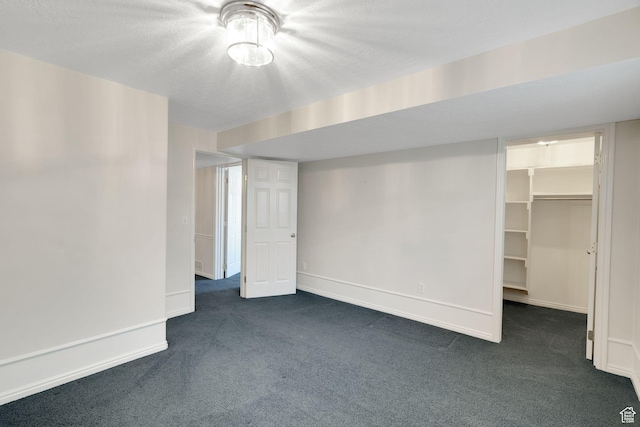8046 W Harker Canyon Dr, Magna, UT 84044 - basement featuring dark carpet and baseboards
