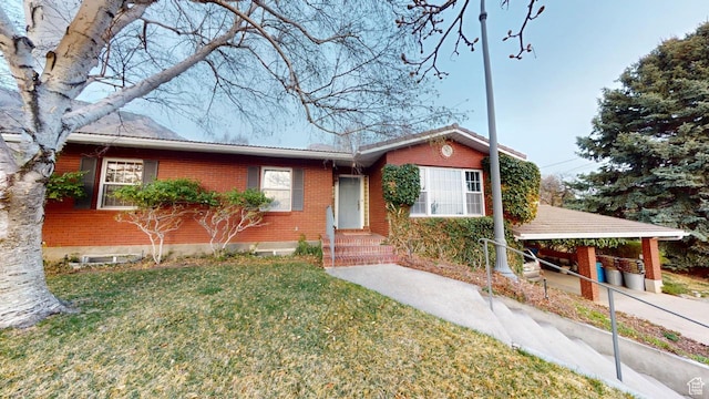 1525 E 200 S, Pleasant Grove, UT 84062 - ranch-style house with a front yard and brick siding