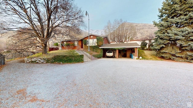 1525 E 200 S, Pleasant Grove, UT 84062 - single story home featuring a carport, driveway, fence, and a mountain view