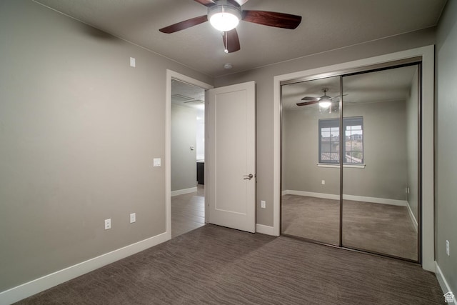 unfurnished bedroom featuring a closet, baseboards, carpet flooring, and ceiling fan
