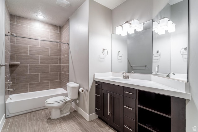 full bath featuring bathing tub / shower combination, vanity, baseboards, and toilet