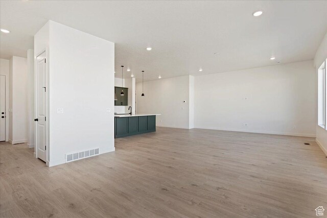 1318 E Larkspur Way, Layton, UT 84040 - unfurnished living room featuring visible vents, light wood-style flooring, and recessed lighting