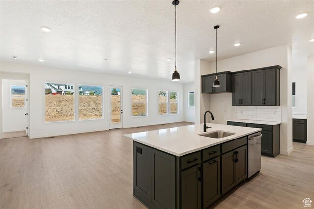 1318 E Larkspur Way, Layton, UT 84040 - kitchen with recessed lighting, light countertops, light wood-style floors, stainless steel dishwasher, and a sink