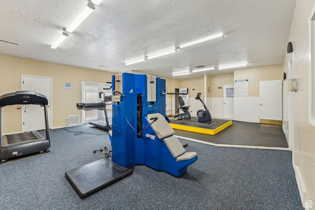 1039 E Quail Vista Ln Unit I, Salt Lake City, UT 84117 - exercise room with visible vents, baseboards, and a textured ceiling