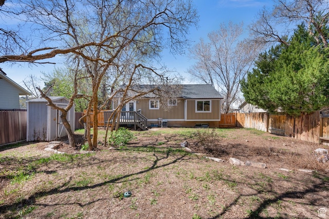 1705 E 2800 N, Layton, UT 84040 - view of yard featuring an outbuilding, a fenced backyard, a storage shed, and a deck