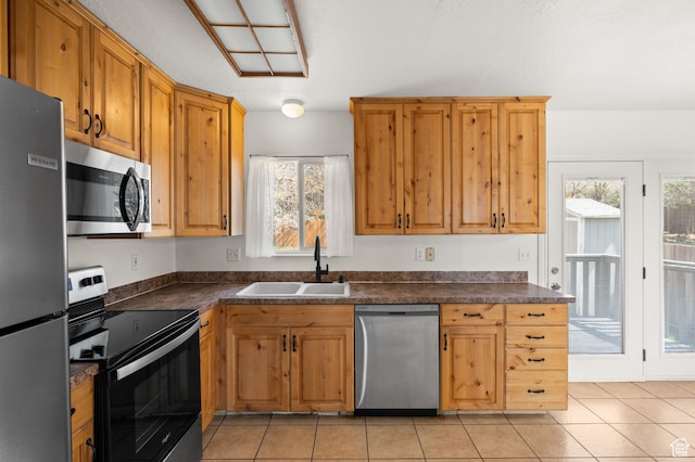 1705 E 2800 N, Layton, UT 84040 - kitchen with a wealth of natural light, dark countertops, and appliances with stainless steel finishes