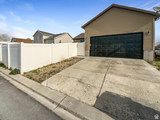 1786 E Juniper Dr, Eagle Mountain, UT 84005 - view of property exterior featuring a garage and fence
