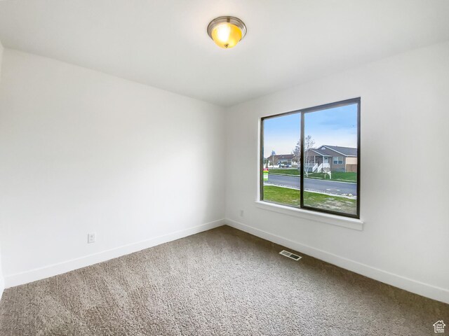 1786 E Juniper Dr, Eagle Mountain, UT 84005 - empty room featuring baseboards, visible vents, and carpet