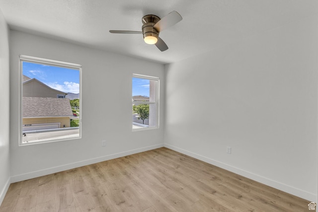 4751 W Vermillion Dr, South Jordan, UT 84009 - unfurnished room with light wood-style floors, baseboards, and a ceiling fan