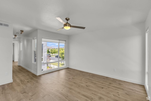 4751 W Vermillion Dr, South Jordan, UT 84009 - unfurnished room with light wood finished floors, ceiling fan, and baseboards