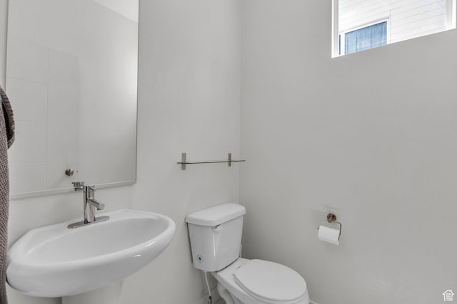 4751 W Vermillion Dr, South Jordan, UT 84009 - half bath featuring a sink, toilet, and baseboards