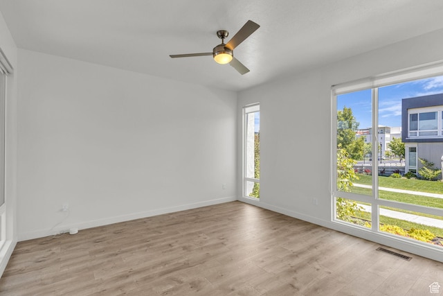 4751 W Vermillion Dr, South Jordan, UT 84009 - unfurnished room featuring light wood finished floors, baseboards, and a ceiling fan