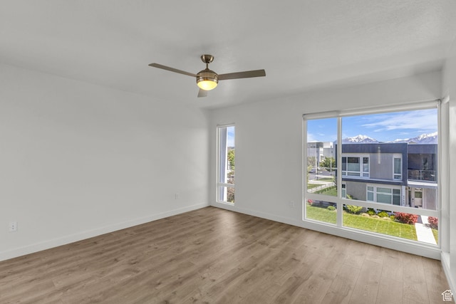 4751 W Vermillion Dr, South Jordan, UT 84009 - unfurnished room with wood finished floors, baseboards, and a ceiling fan