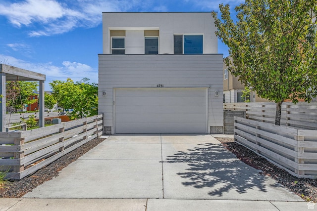 4751 W Vermillion Dr, South Jordan, UT 84009 - contemporary house with an attached garage and driveway