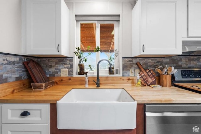 706 E Cottontail Rd, Central, UT 84722 - kitchen with a sink, backsplash, white cabinetry, and stainless steel appliances