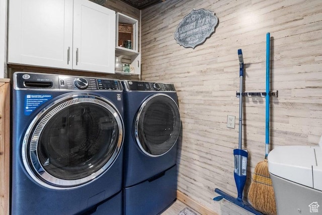 706 E Cottontail Rd, Central, UT 84722 - clothes washing area featuring cabinet space, wood walls, and independent washer and dryer