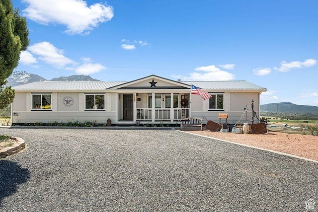 706 E Cottontail Rd, Central, UT 84722 - view of front of property with a porch, metal roof, and a mountain view
