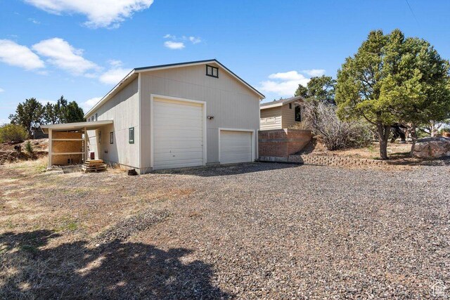 706 E Cottontail Rd, Central, UT 84722 - view of home's exterior with an outdoor structure and a garage