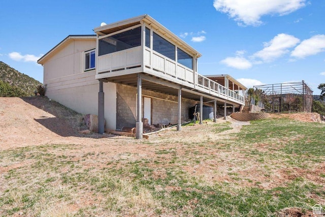 706 E Cottontail Rd, Central, UT 84722 - back of house featuring a wooden deck and a sunroom