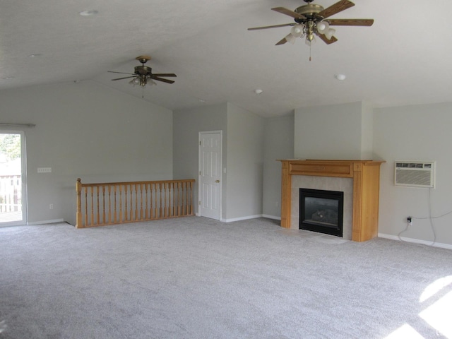 45 River Circle Dr, Logan, UT 84321 - unfurnished living room featuring a wall mounted air conditioner, vaulted ceiling, light carpet, and a ceiling fan