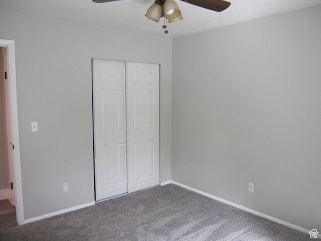45 River Circle Dr, Logan, UT 84321 - unfurnished bedroom featuring a closet, dark colored carpet, a ceiling fan, and baseboards