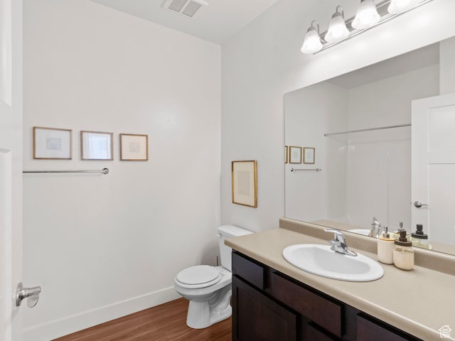 3679 W 1530 N Unit 102, Lehi, UT 84043 - full bathroom featuring vanity, visible vents, toilet, wood finished floors, and baseboards