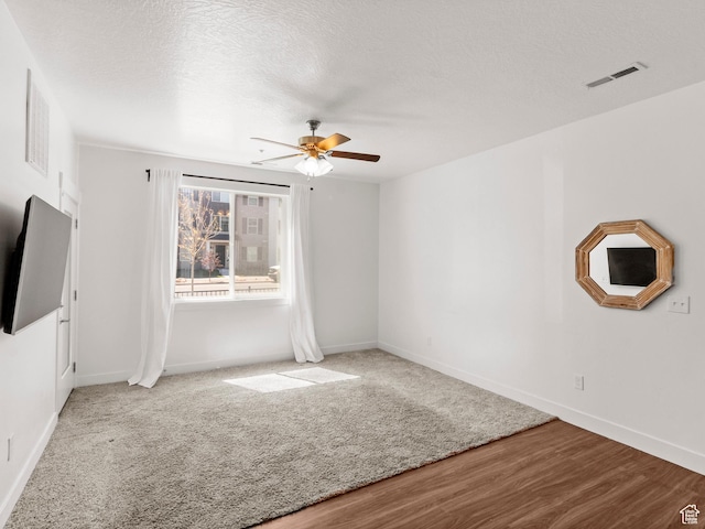 3679 W 1530 N Unit 102, Lehi, UT 84043 - unfurnished living room featuring visible vents, baseboards, a ceiling fan, and wood finished floors