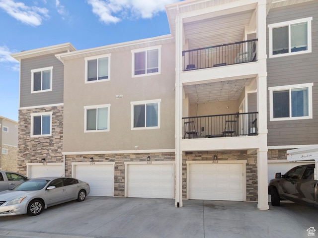 3679 W 1530 N Unit 102, Lehi, UT 84043 - view of property featuring an attached garage and driveway
