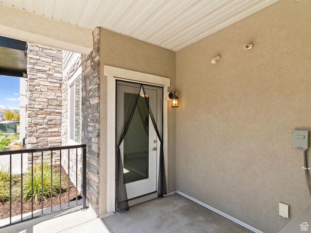 3679 W 1530 N Unit 102, Lehi, UT 84043 - property entrance with stucco siding, stone siding, and a balcony