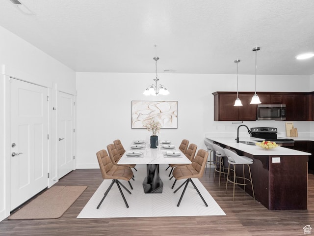3679 W 1530 N Unit 102, Lehi, UT 84043 - dining area with a chandelier, dark wood-style flooring, baseboards, and visible vents