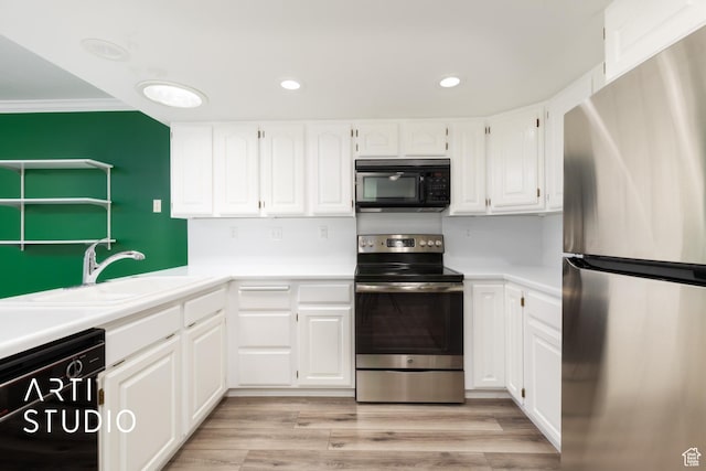 1454 W Cornerstone Dr, South Jordan, UT 84095 - kitchen featuring recessed lighting, light countertops, white cabinetry, black appliances, and a sink