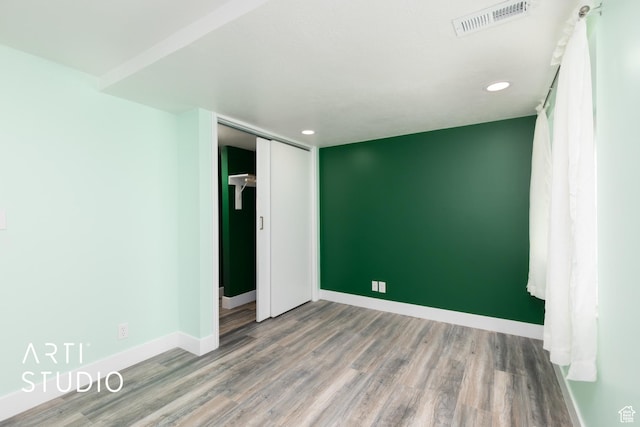 1454 W Cornerstone Dr, South Jordan, UT 84095 - unfurnished bedroom featuring wood finished floors, baseboards, visible vents, and recessed lighting