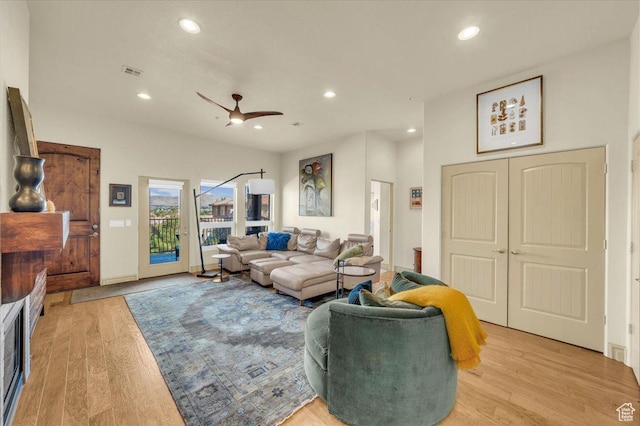 living area featuring recessed lighting, visible vents, and light wood-type flooring